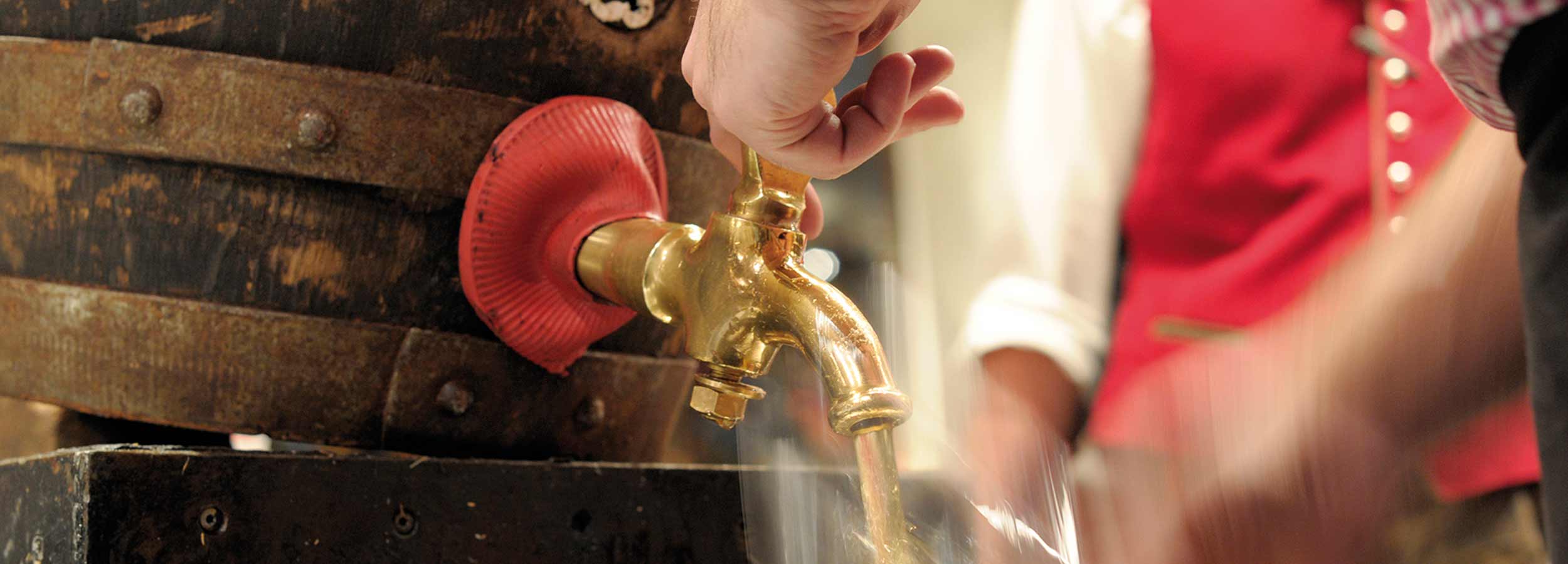 Beer serving from the chilled wooden barrel in the Bavarian restaurant &bdquo;Pschorr&ldquo;